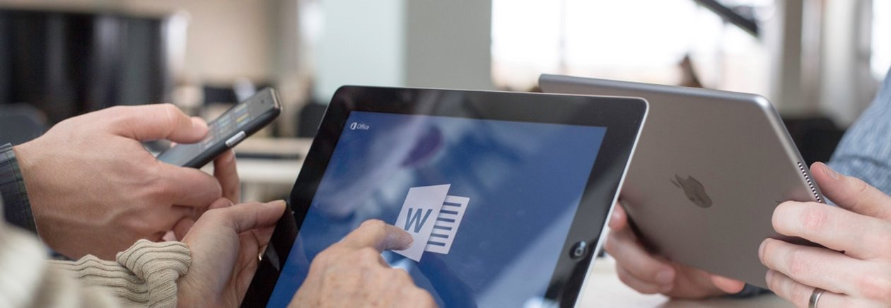 A person reading a document on a tablet