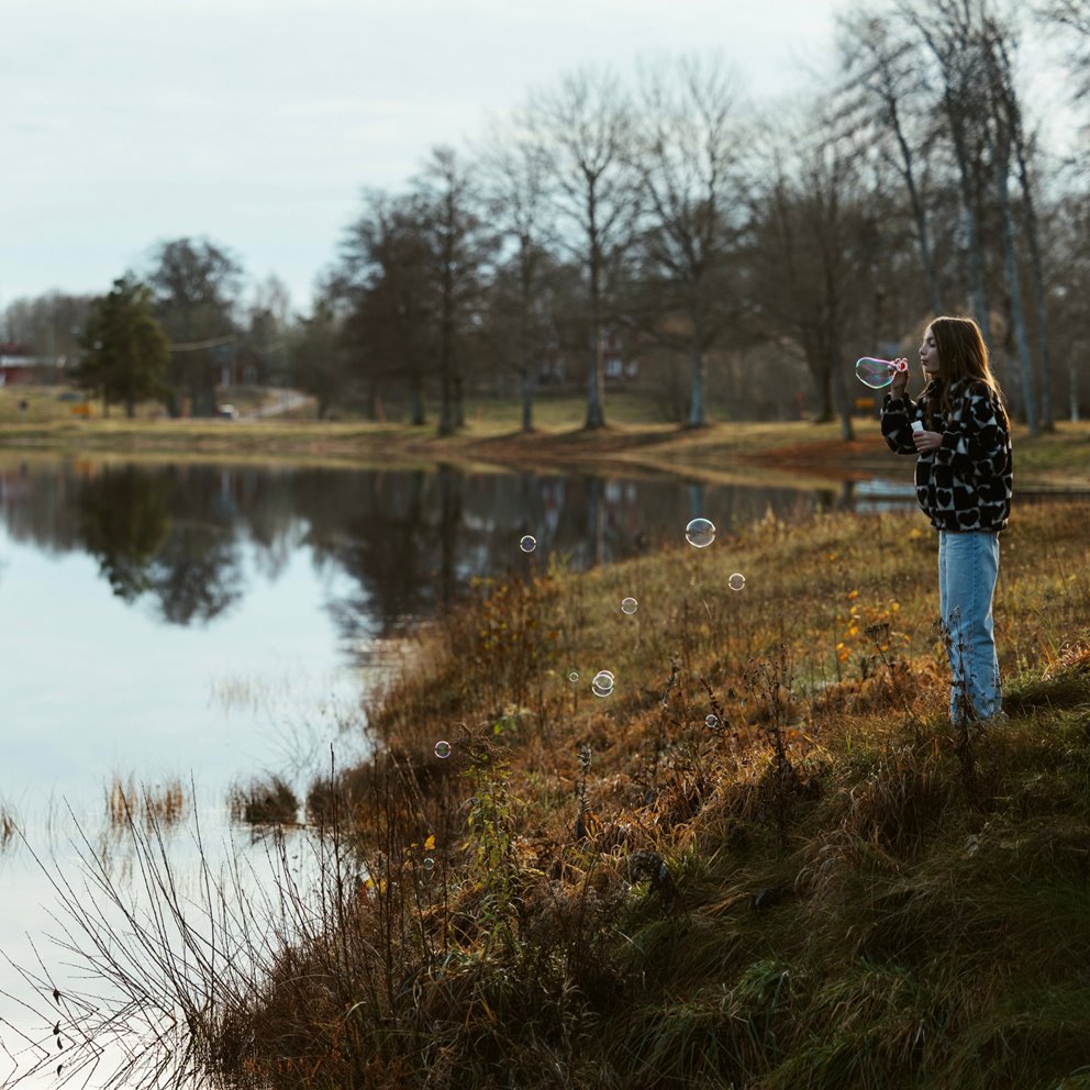 Girl by a pretty lake